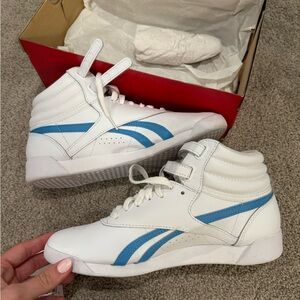 Reebok white shoes with stripe details
